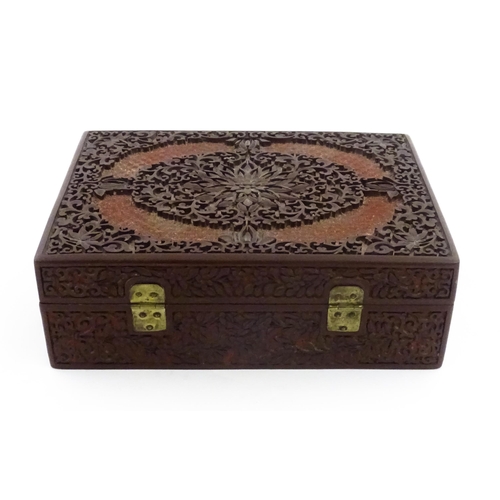 1042 - A 20thC Chinese jewellery box with cinnabar lacquer style scrolling floral decoration, opening to re... 