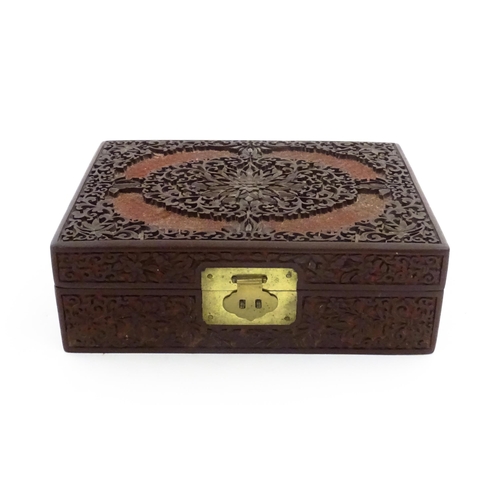 1042 - A 20thC Chinese jewellery box with cinnabar lacquer style scrolling floral decoration, opening to re... 