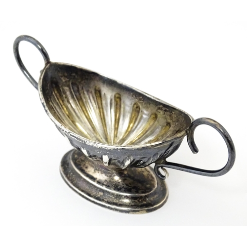 345 - A silver twin handled pedestal salt. Hallmarked Chester 1897 maker Florence Warden. Approx 4