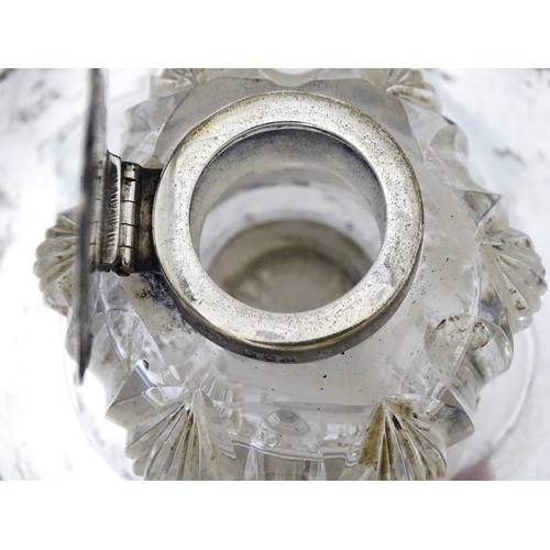 346 - A Victorian cut glass inkwell on silver stand and with silver mounts and lid. Hallmarked London 1900... 