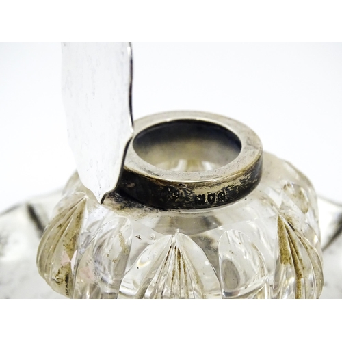 346 - A Victorian cut glass inkwell on silver stand and with silver mounts and lid. Hallmarked London 1900... 