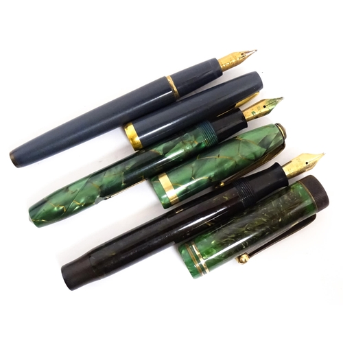 1137 - A Parker, England 'Duofold' fountain pen with 14k gold nib and green celluloid decoration. Together ... 