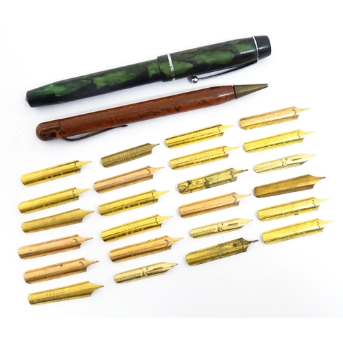 1140A - A Mentmore fountain pen with 14k gold nib and green celluloid finish. Together with a Bakelite prope... 