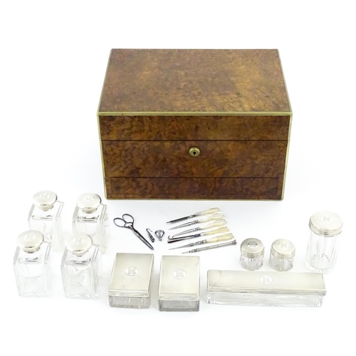 1142 - A Victorian brass bound walnut travelling vanity case / box with sprung section lower and to side, o... 