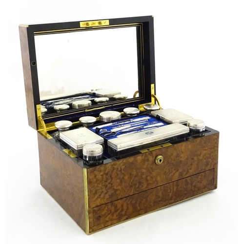 1142 - A Victorian brass bound walnut travelling vanity case / box with sprung section lower and to side, o... 