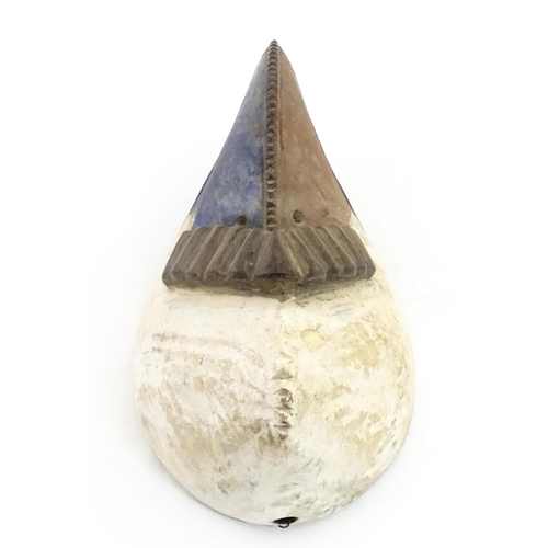 1180 - Ethnographic / Native / Tribal : An African bird mask with polychrome detail. Approx. 13 1/2