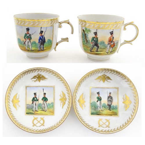 222 - Two Polish Korzec tea cups and saucers with hand painted decoration depicting 18thC Infantry soldier... 