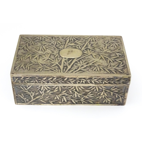 343 - A Chinese export white metal box with bamboo decoration and opening to reveal a gilded two sectional... 