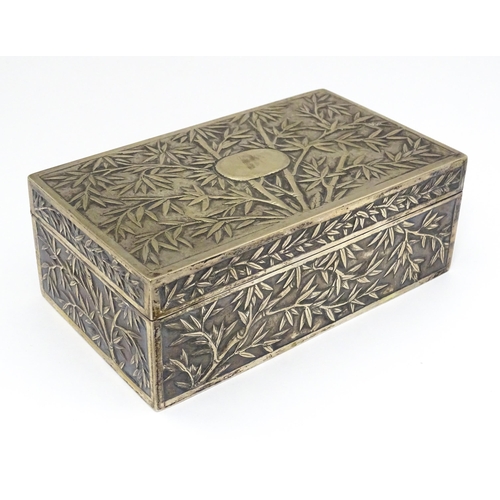 343 - A Chinese export white metal box with bamboo decoration and opening to reveal a gilded two sectional... 