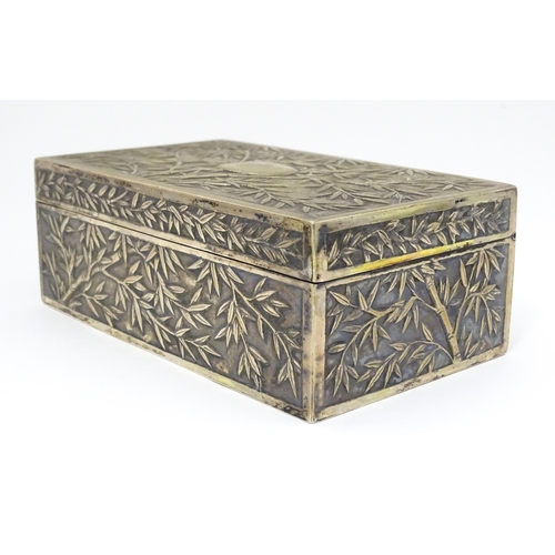 343 - A Chinese export white metal box with bamboo decoration and opening to reveal a gilded two sectional... 