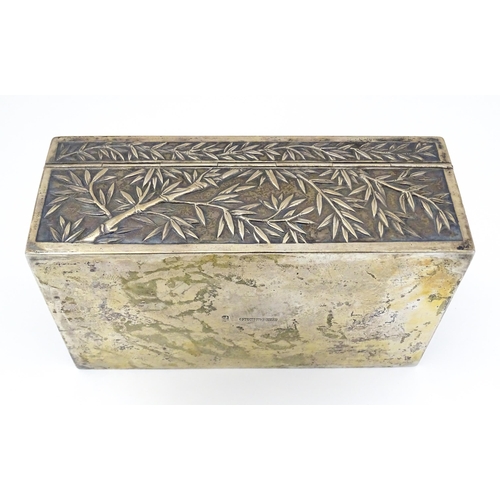 343 - A Chinese export white metal box with bamboo decoration and opening to reveal a gilded two sectional... 
