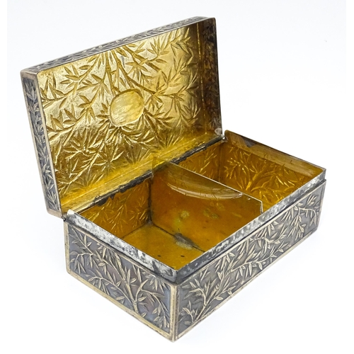 343 - A Chinese export white metal box with bamboo decoration and opening to reveal a gilded two sectional... 