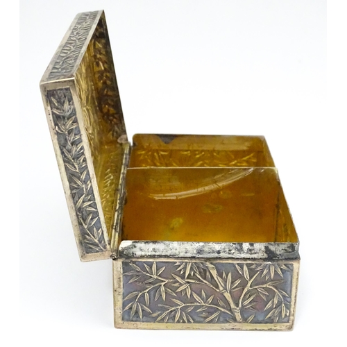 343 - A Chinese export white metal box with bamboo decoration and opening to reveal a gilded two sectional... 