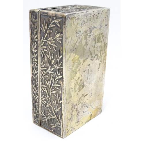 343 - A Chinese export white metal box with bamboo decoration and opening to reveal a gilded two sectional... 