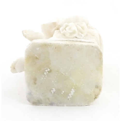 1224 - An Italian alabaster sculpture modelled as a seated child reading a book, after C. Ghilli. Approx. 1... 