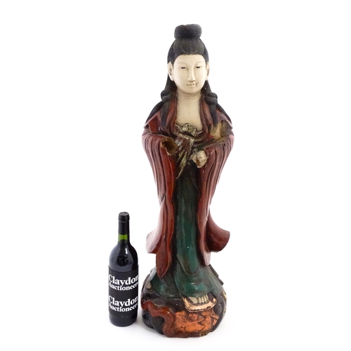 1270 - A large Chinese carved wooden sculpture modelled as Guanyin, with polychrome decoration. Approx. 29 ... 