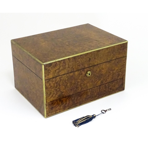 1142 - A Victorian brass bound walnut travelling vanity case / box with sprung section lower and to side, o... 