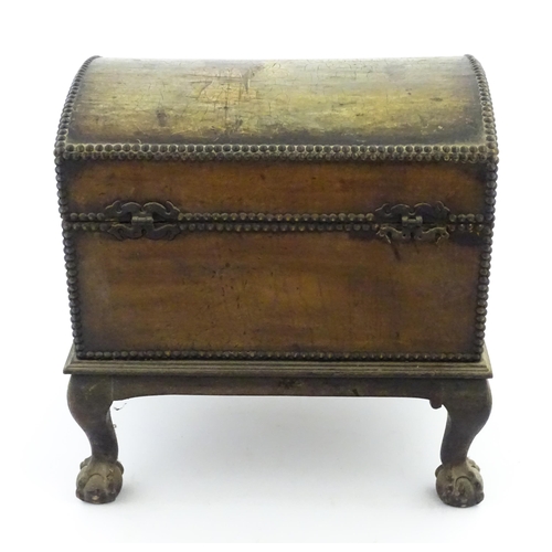 1166 - A domed chest on stand / trunk with painted decoration depicting ships at sea, and stud detail. Appr... 