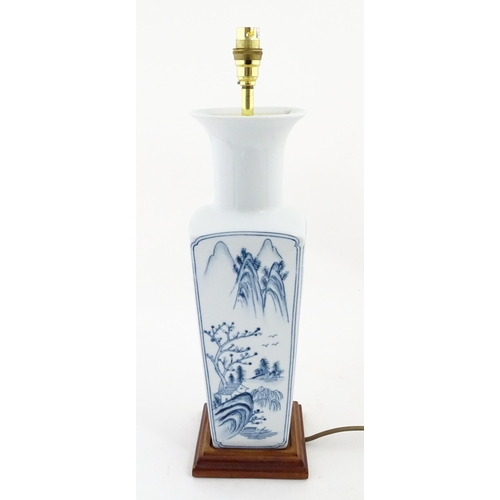 1395 - A Chinese blue and white table lamp of squared form with landscape decoration. Approx. 20
