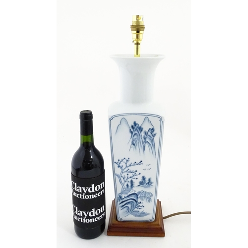 1395 - A Chinese blue and white table lamp of squared form with landscape decoration. Approx. 20