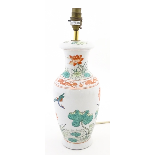 1401 - A Chinese table lamp decorated with lotus flowers and birds, with dragon and flaming pearl border. A... 