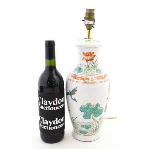 1401 - A Chinese table lamp decorated with lotus flowers and birds, with dragon and flaming pearl border. A... 