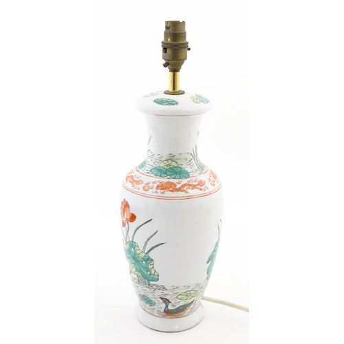 1401 - A Chinese table lamp decorated with lotus flowers and birds, with dragon and flaming pearl border. A... 