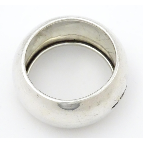 348 - A silver napkin ring hallmarked Sheffield 1931, maker John Henry Potter