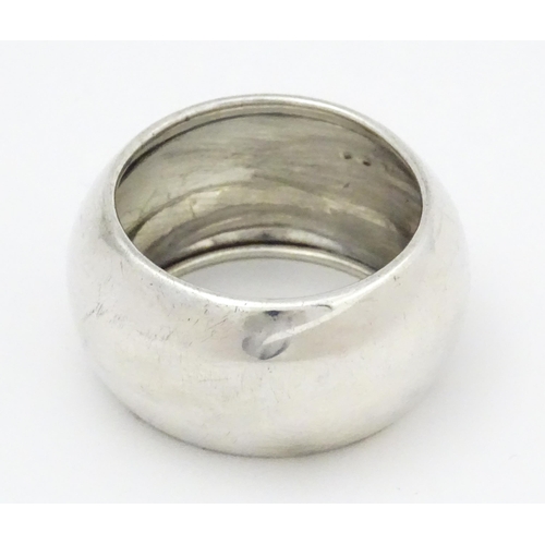 348 - A silver napkin ring hallmarked Sheffield 1931, maker John Henry Potter