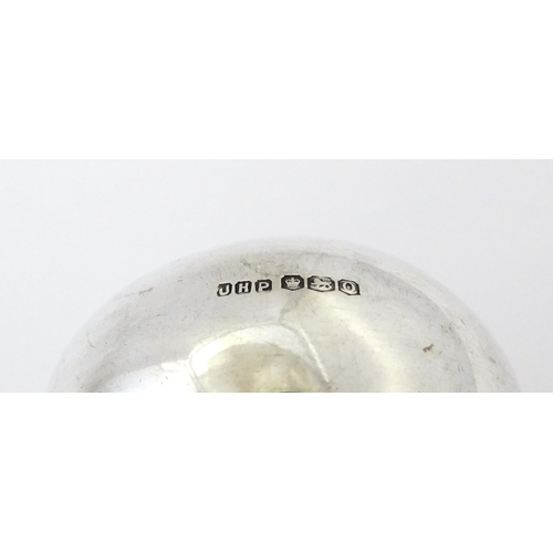 348 - A silver napkin ring hallmarked Sheffield 1931, maker John Henry Potter