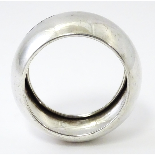 348 - A silver napkin ring hallmarked Sheffield 1931, maker John Henry Potter