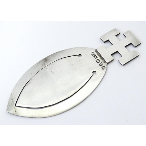 350 - A silver bookmark / page marker surmounted by a cross hallmarked Chester 1907, maker F J Ross & Sons... 