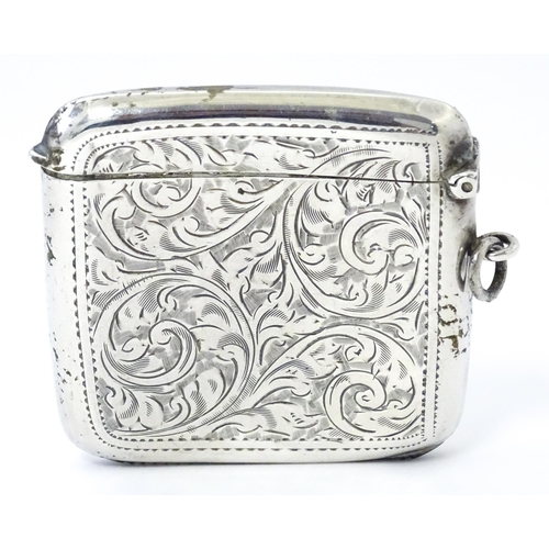 352 - A large silver vesta case with engraved acanthus scroll decoration, hallmarked Birmingham 1921, make... 
