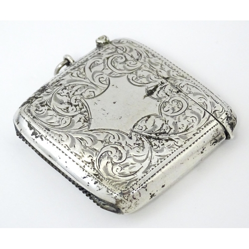 352 - A large silver vesta case with engraved acanthus scroll decoration, hallmarked Birmingham 1921, make... 