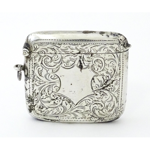 352 - A large silver vesta case with engraved acanthus scroll decoration, hallmarked Birmingham 1921, make... 