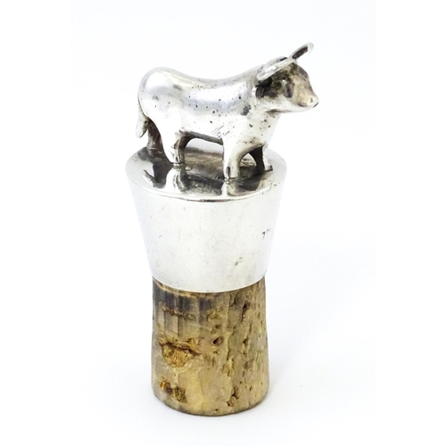 353 - A silver bottle stopper with bull finial. Approx. 2 3/4