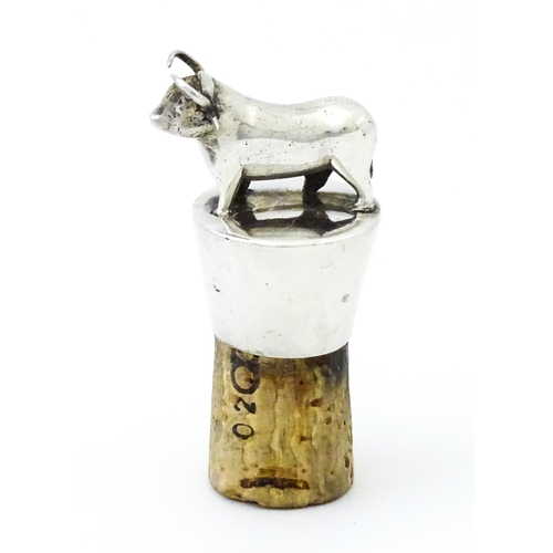 353 - A silver bottle stopper with bull finial. Approx. 2 3/4