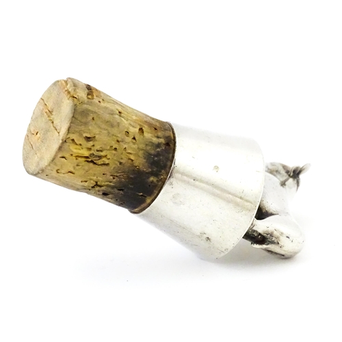 353 - A silver bottle stopper with bull finial. Approx. 2 3/4