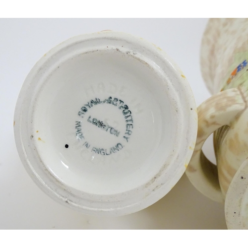 206 - A Bewley Pottery Art Deco vase of flared form with hand painted landscape decoration, in the manner ... 