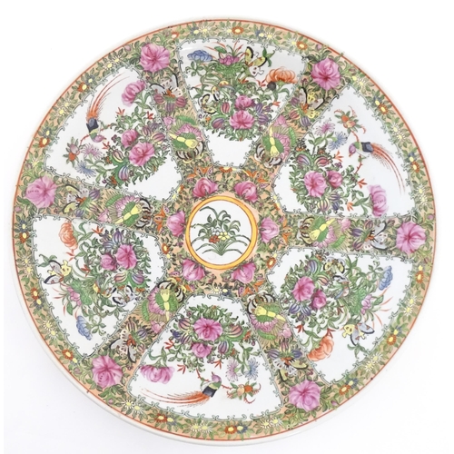 228 - A large Chinese Cantonese famille rose charger decorated with birds, flowers and butterflies. Charac... 