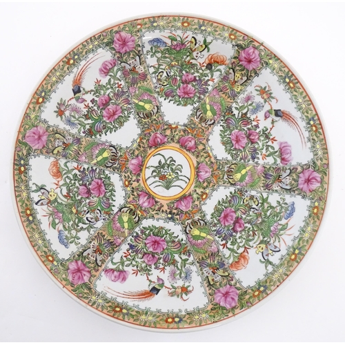 228 - A large Chinese Cantonese famille rose charger decorated with birds, flowers and butterflies. Charac... 