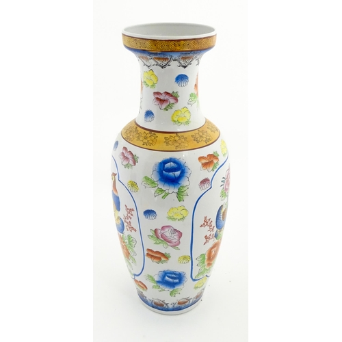 65 - A large Chinese vase decorated with birds and flowers. Marked under. Approx. 24