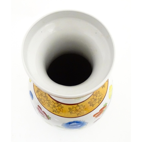 65 - A large Chinese vase decorated with birds and flowers. Marked under. Approx. 24