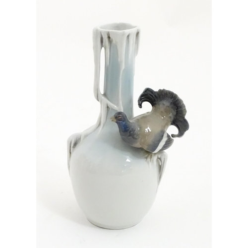 88A - A German Metzler & Ortloff vase with capercaillie bird detail. Approx. 8 3/4