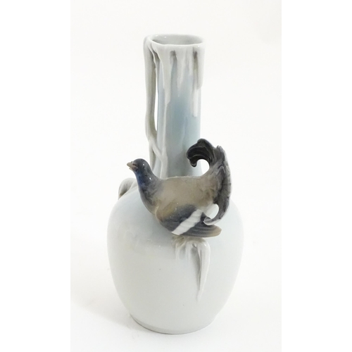 88A - A German Metzler & Ortloff vase with capercaillie bird detail. Approx. 8 3/4