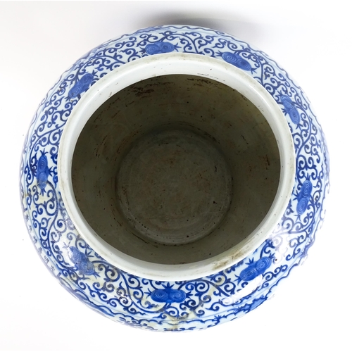 62 - A large Chinese blue and white jardiniere of bulbous form decorated with figures in a garden landsca... 