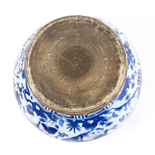 62 - A large Chinese blue and white jardiniere of bulbous form decorated with figures in a garden landsca... 
