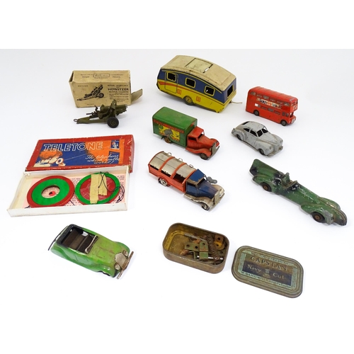 1300 - Toys: A quantity of vintage toys to include Teletone, a die cast scale mode Dinky Toys Routemaster B... 