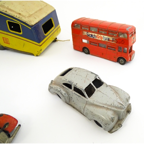 1300 - Toys: A quantity of vintage toys to include Teletone, a die cast scale mode Dinky Toys Routemaster B... 