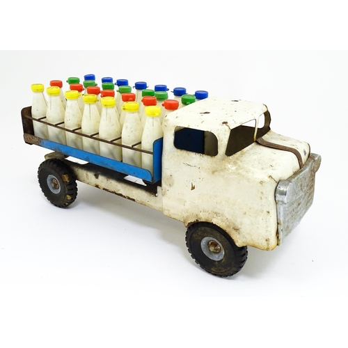 1320 - Toys: A tinplate Tri-ang Hi-way Milk Float / truck with milk bottles. Approx. 13 3/4
